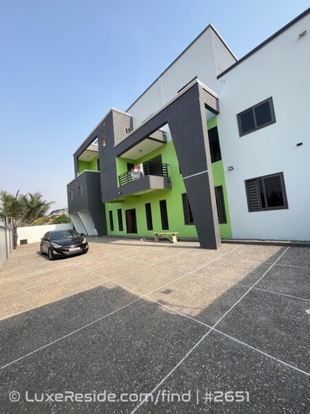Ample parking and maneuvering space within the paved compound.
