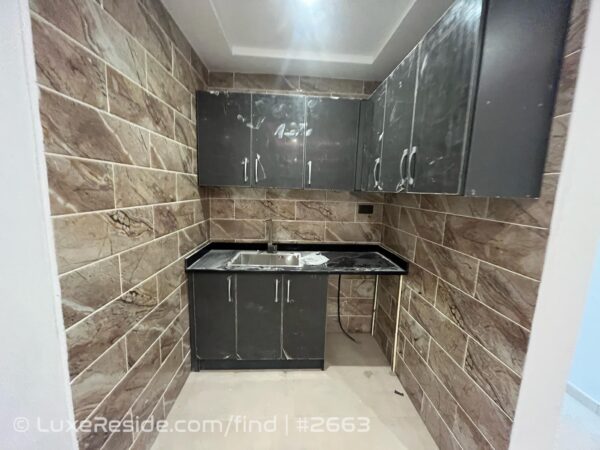 Functional kitchenette space with modern finishes.