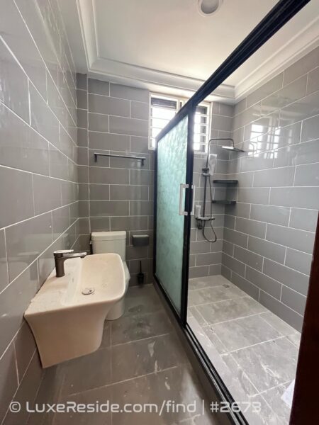 Contemporary bathroom with a spacious walk-in shower enclosed by a modern glass screen.