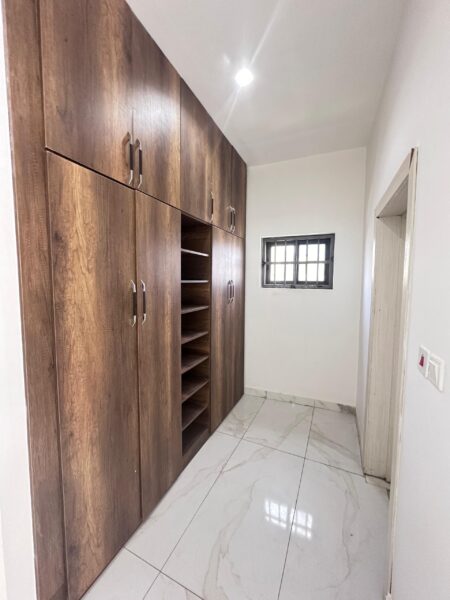Clean and contemporary built-in wardrobes offering plenty of storage space.