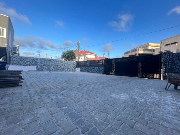 Spacious and secure compound with parking for residents.