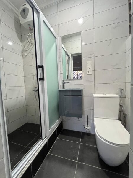 Modern bathroom equipped with water heaters and high-quality fittings.