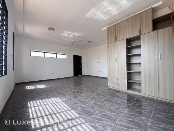 Ensuite bedroom with built-in wardrobes and plenty of natural light.