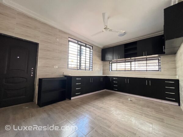 Fully fitted kitchen with sleek cabinets and ample storage.