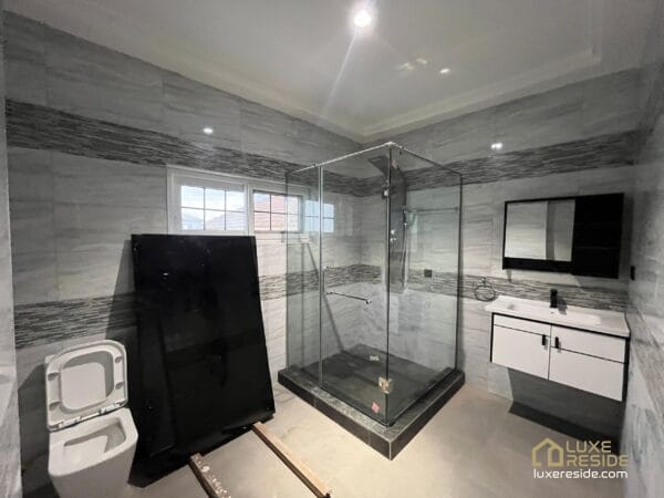 Luxurious bathroom featuring a glass-enclosed shower and contemporary design.