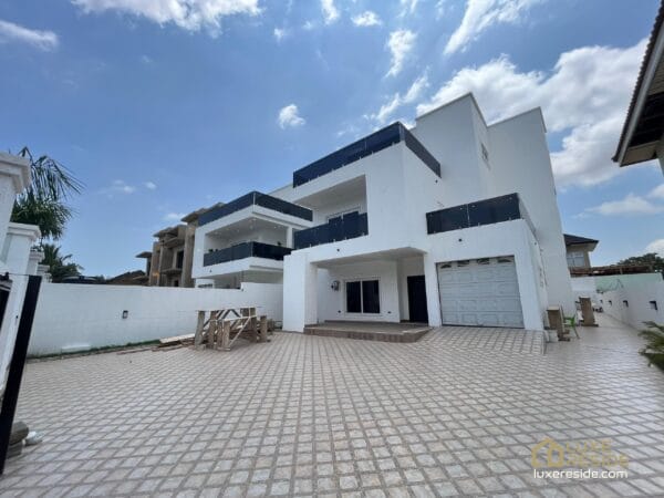 Front view of the house, showcasing its modern design and private garage.