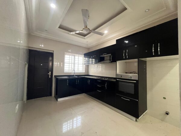 Sleek kitchen design with ample storage and preparation space.