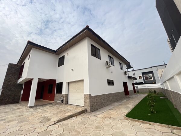 Spacious paved compound offering parking and privacy in this secure Trasacco home.