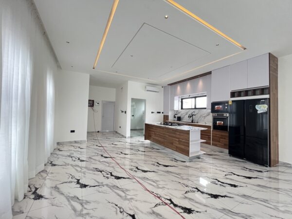 Gourmet kitchen featuring marble countertops, wood accents and premium appliances.
