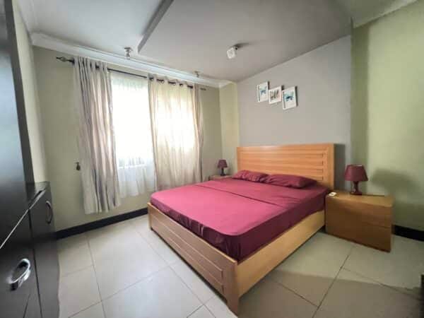 Secondary bedroom offering modern comfort and plenty of storage.