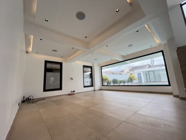 Spacious living area with an open floor plan and modern finishes.