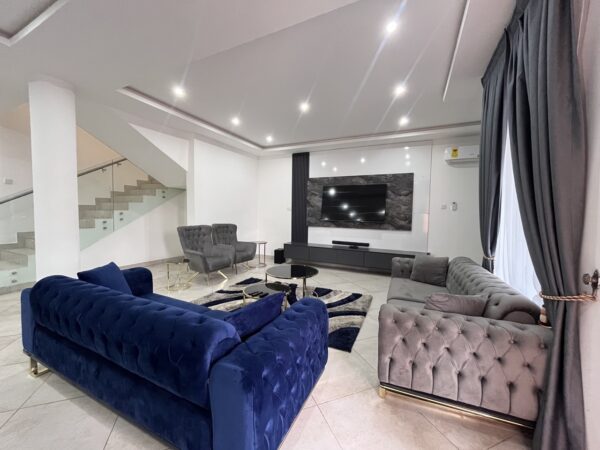 Cozy living room with a modern sectional sofa and entertainment center.