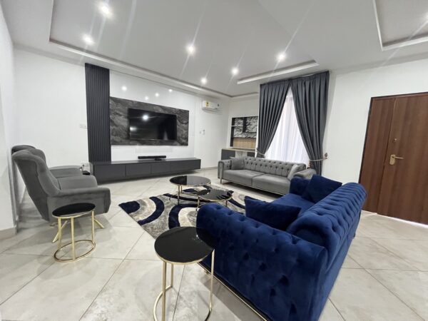 Cozy living room with a modern sectional sofa and entertainment center.
