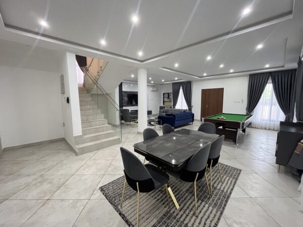 Open living area with pool table, perfect for entertaining guests.