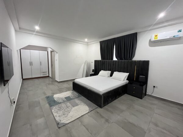 Fully furnished bedroom with modern decor