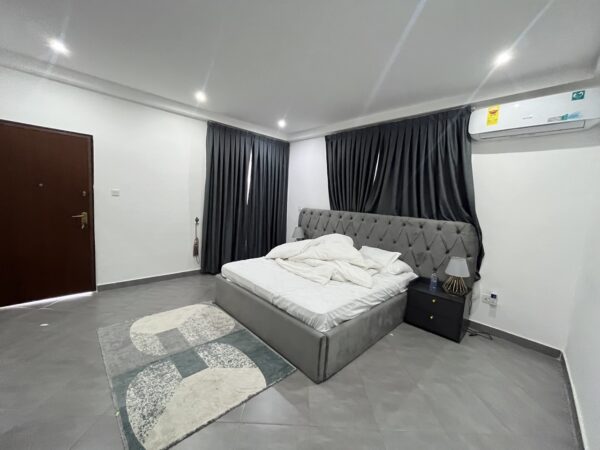 Fully furnished bedroom with modern decor