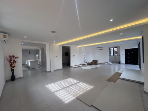 Bright living space with secure sliding doors and natural light.