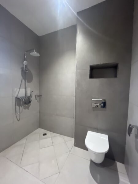 Modern bathroom featuring elegant fixtures and a spacious design.