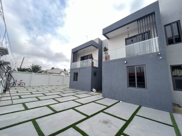 Sleek 4-bedroom home with an expansive courtyard and ample parking.