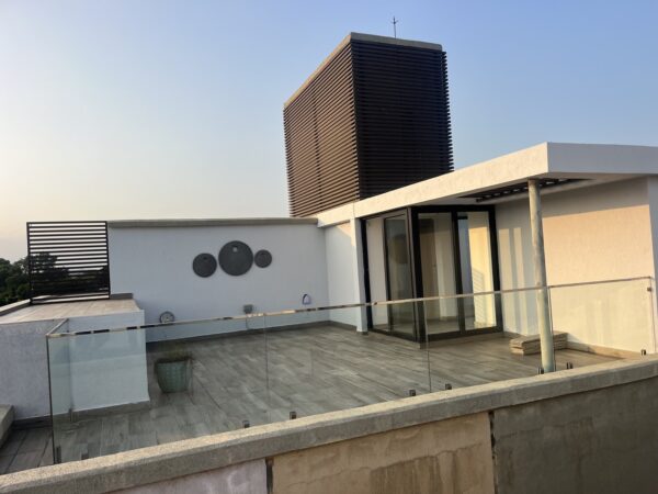 Soak up city views on your furnished rooftop terrace, perfect for gatherings.