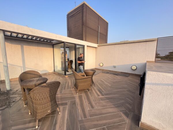 Soak up city views on your furnished rooftop terrace, perfect for gatherings.