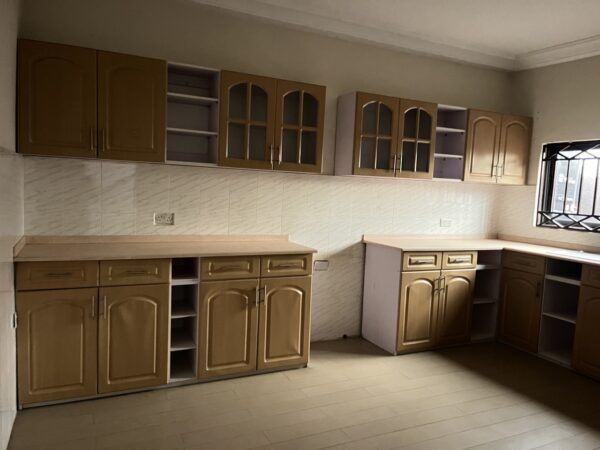 Kitchen with wooden cabinetry and plenty of countertop space.