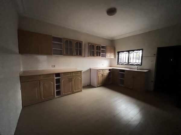 Kitchen with wooden cabinetry and plenty of countertop space.