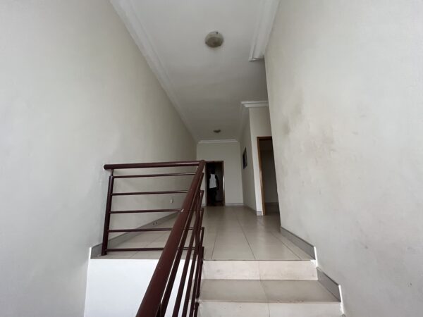 Secure and spacious staircase leading to the upper floor.