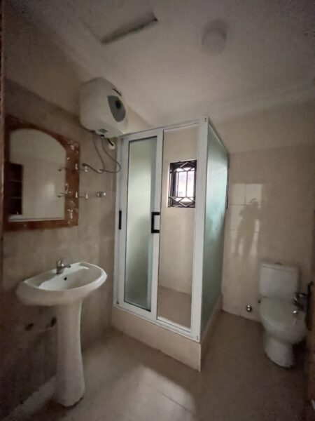 Bathroom featuring a glass-enclosed shower and modern fixtures.