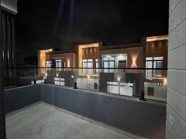Private balcony with tempered glass railing, perfect for evening relaxation.