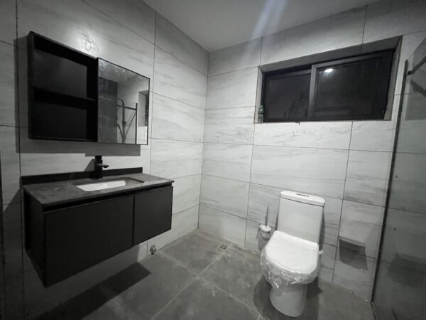 Chic bathroom design with a glass-enclosed shower and premium fixtures.