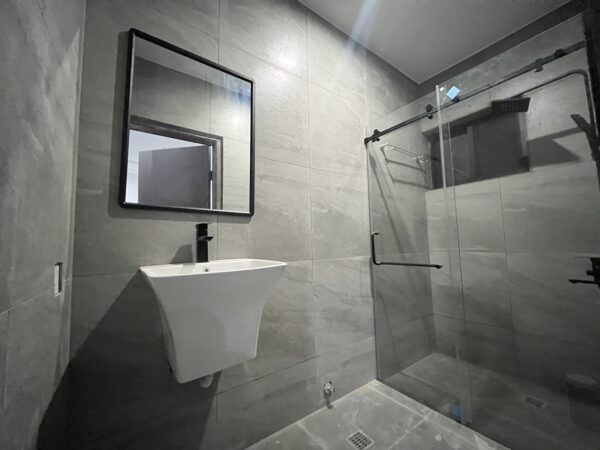 Chic bathroom design with a glass-enclosed shower and premium fixtures.