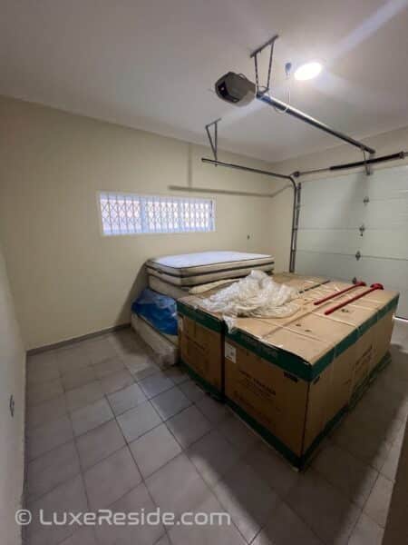 Secure garage with space for parking and additional storage.
