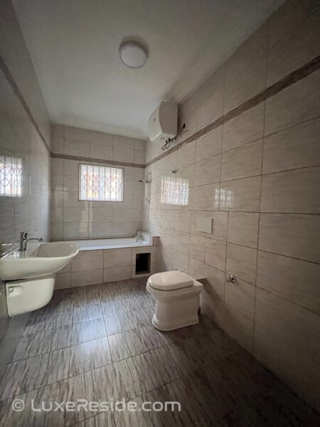 Master bathroom with a bathtub, shower, and vanity.
