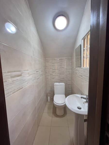 Convenient guest bathroom with modern finishes.